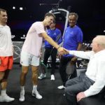 Jakub Mensik says hello to Rod Laver.