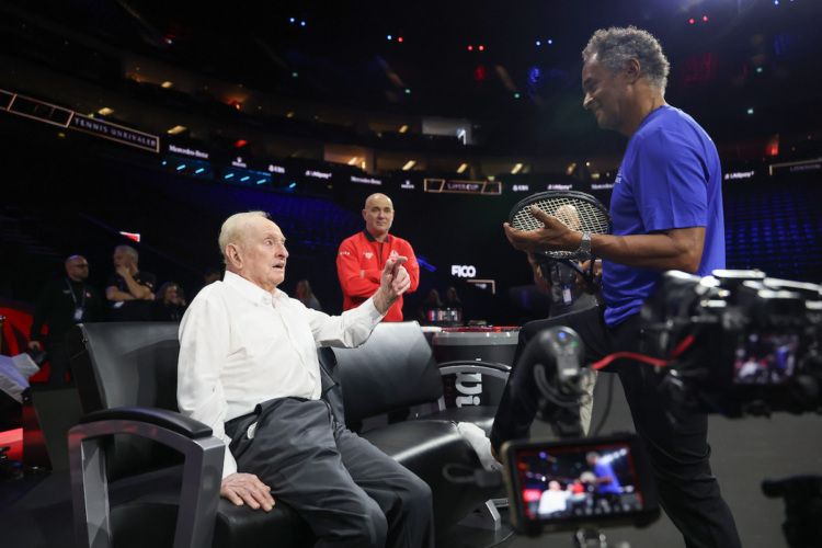 Rod Laver talks tennis with Team Europe captain Yannick Noah as Andre Agassi listens in.