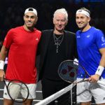 John McEnroe tosses the coin for the first match between Francisco Cerundolo and Casper Ruud.