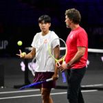 Team World vice-captain Patrick Rafter trains with Learner Tien.