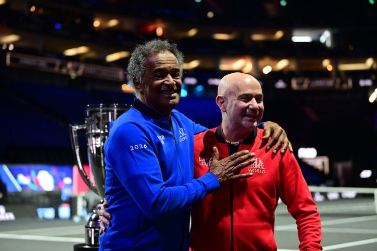 Friends off court, rivals within. Team Europe captain Yannick Noah greets Team World captain Andre Agassi in London. 