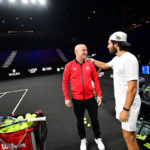 Carlos Alcaraz shares a warm hello with Team World captain, Andre Agassi.