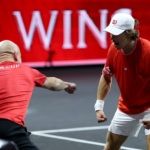Agassi celebrates with De Minaur.