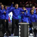 The Team Europe bench rise to celebrate Zverev's Cup-clinching moment on Sunday.